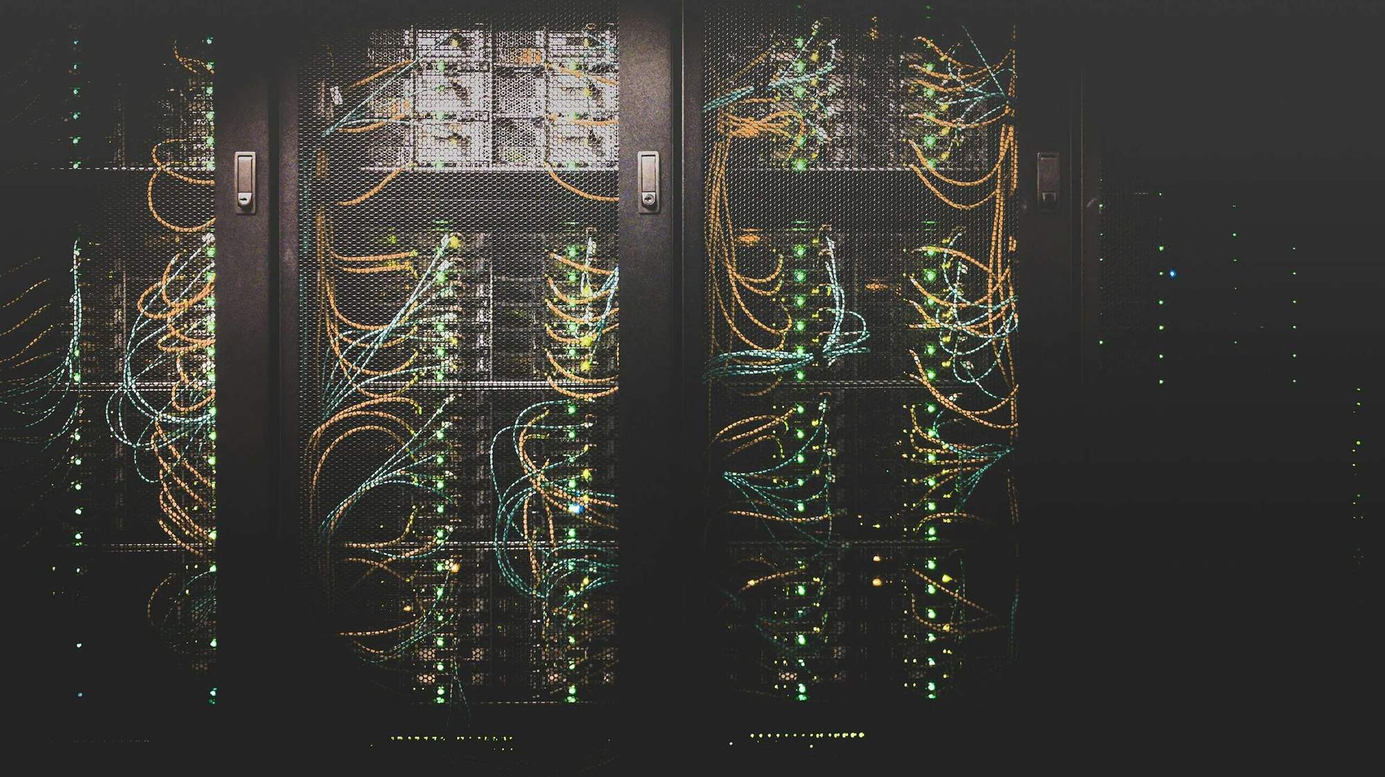 Communications room racks with patched network cabling